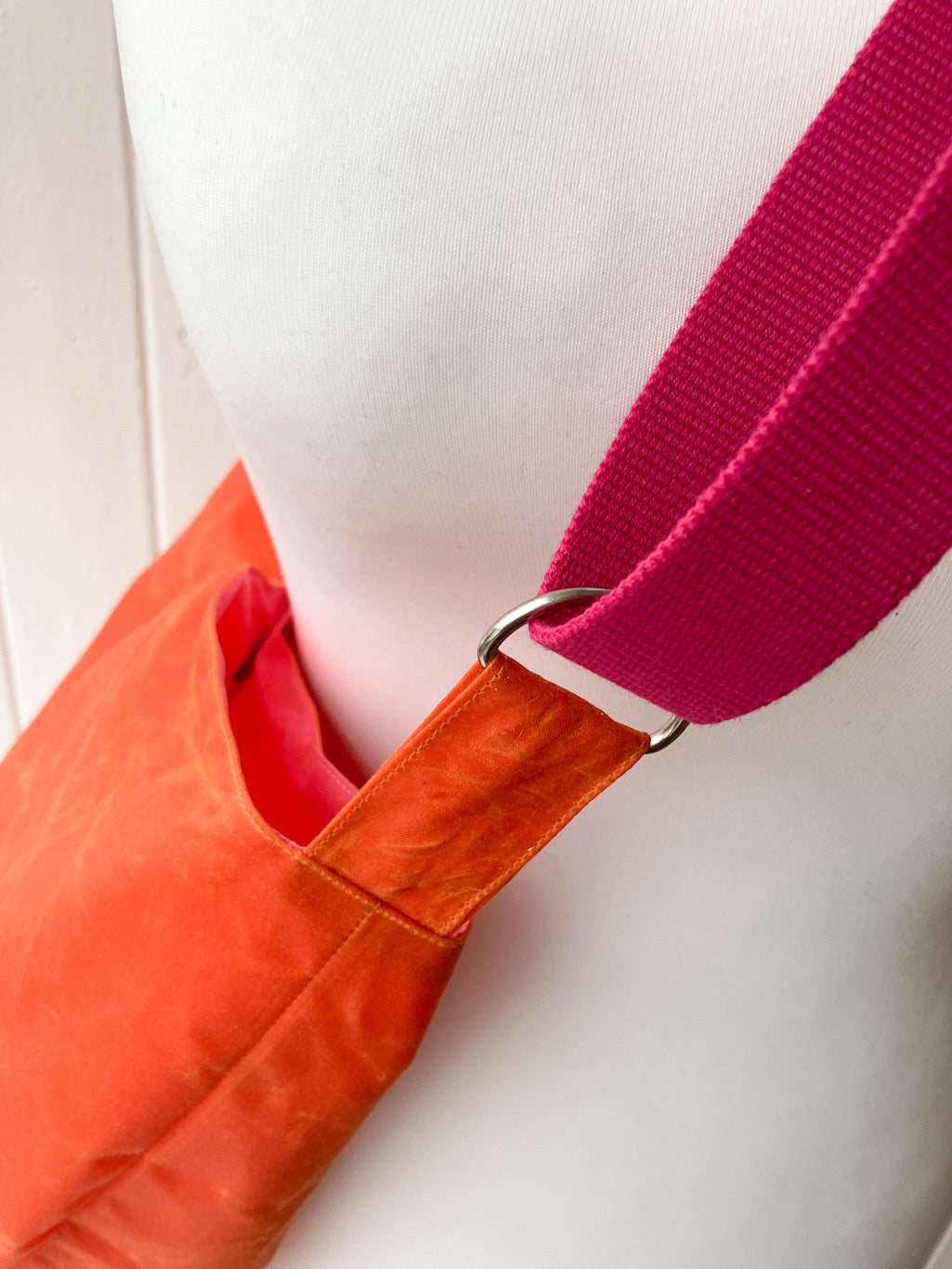 small orange oilskin bucket bag