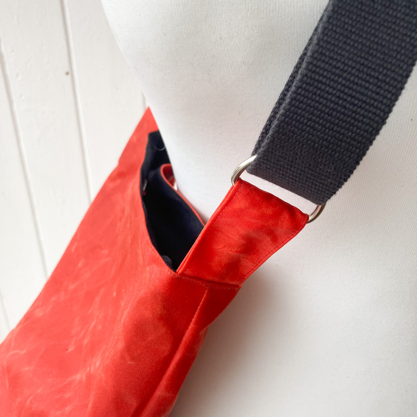 small dark orange oilskin bucket bag