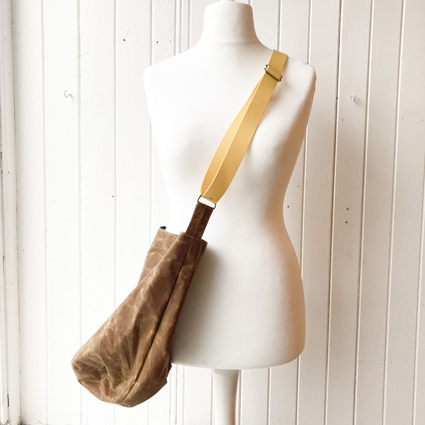medium tan oilskin bucket bag