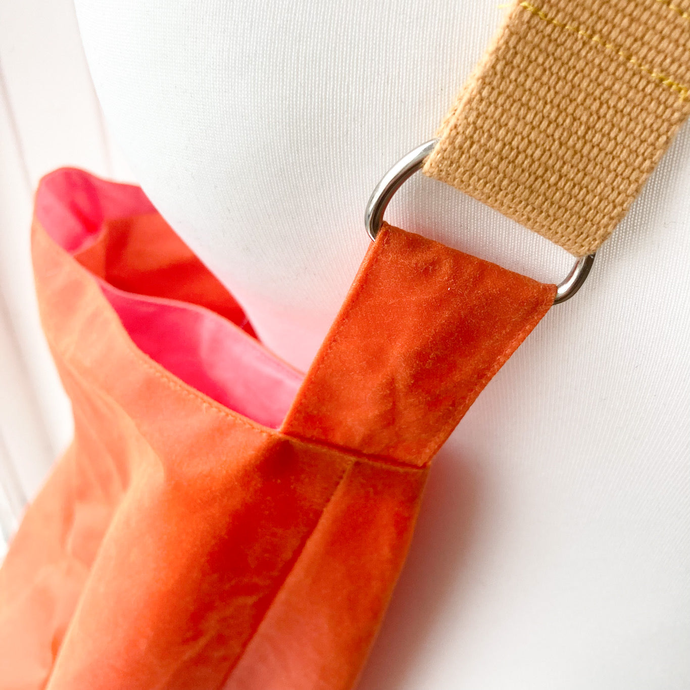 large orange with mustard strap oilskin bucket bag