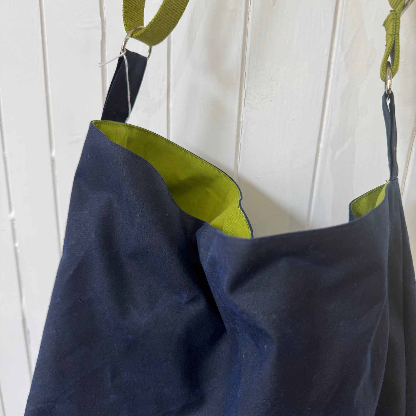 large dark blue oilskin bucket bag