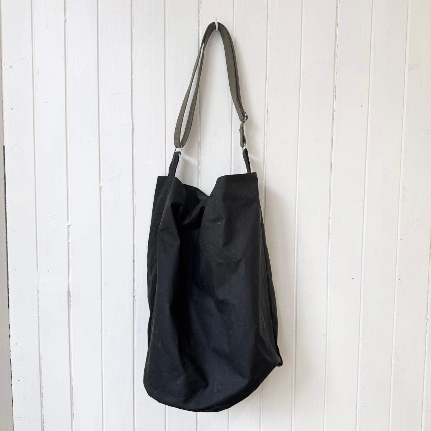 large dark khaki oilskin bucket bag