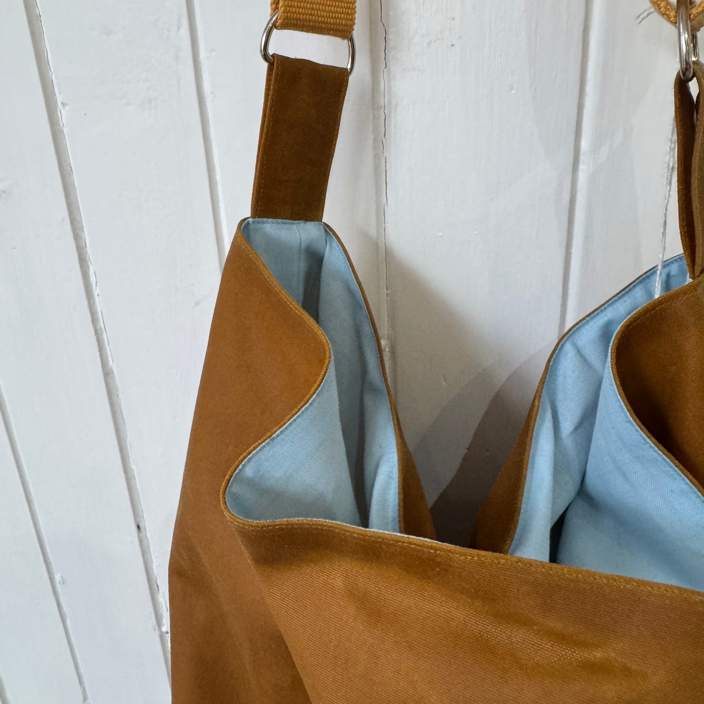 large tan oilskin bucket bag