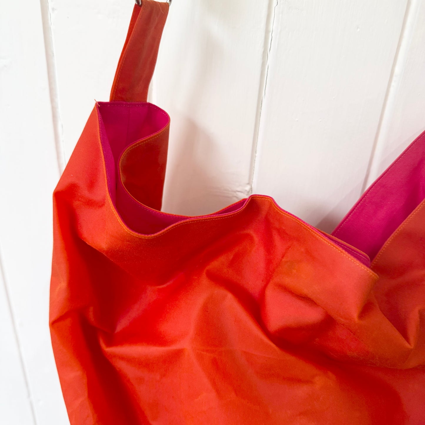 large orange oilskin bucket bag