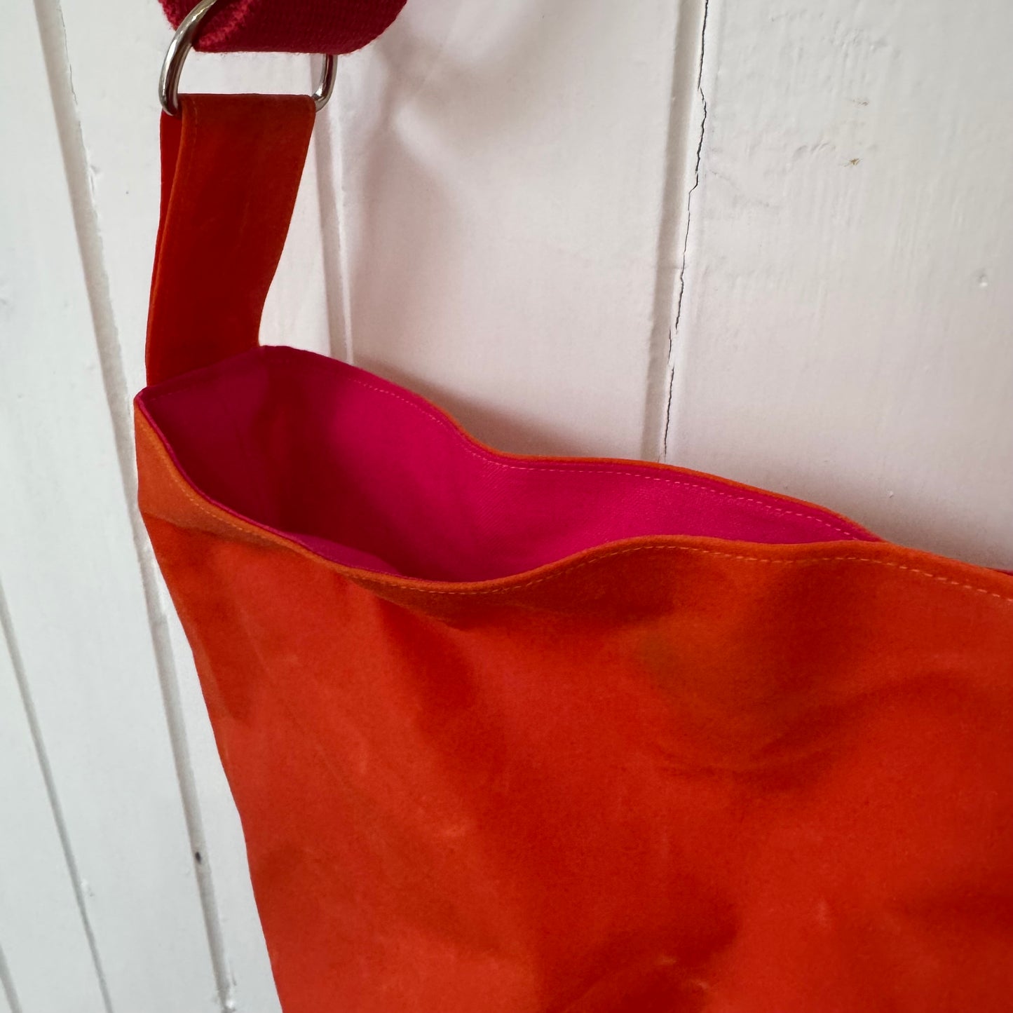 small orange oilskin bucket bag