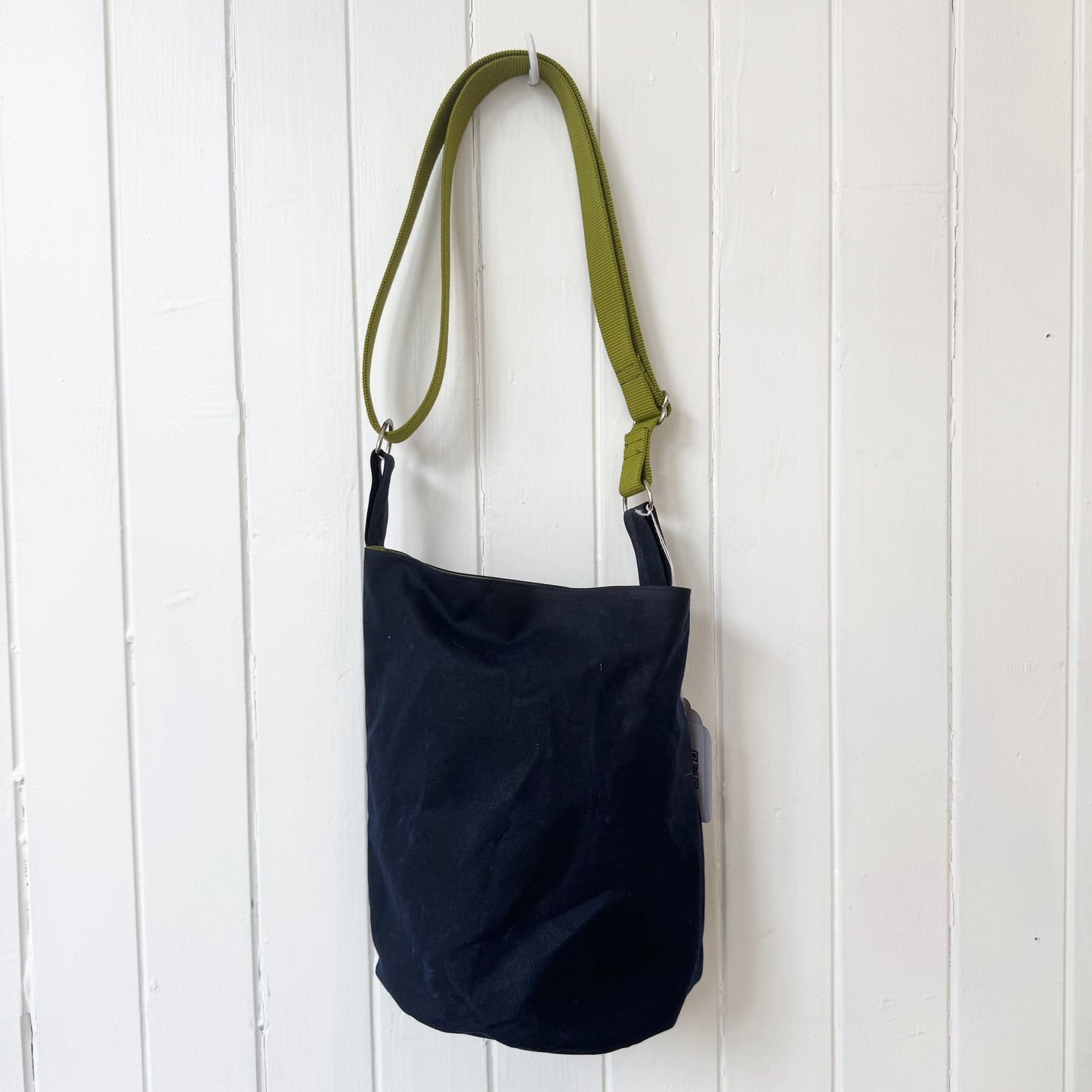 small dark blue oilskin bucket bag