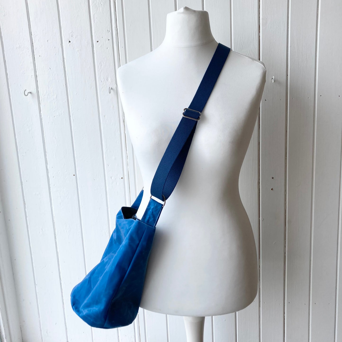 small bright blue oilskin bucket bag
