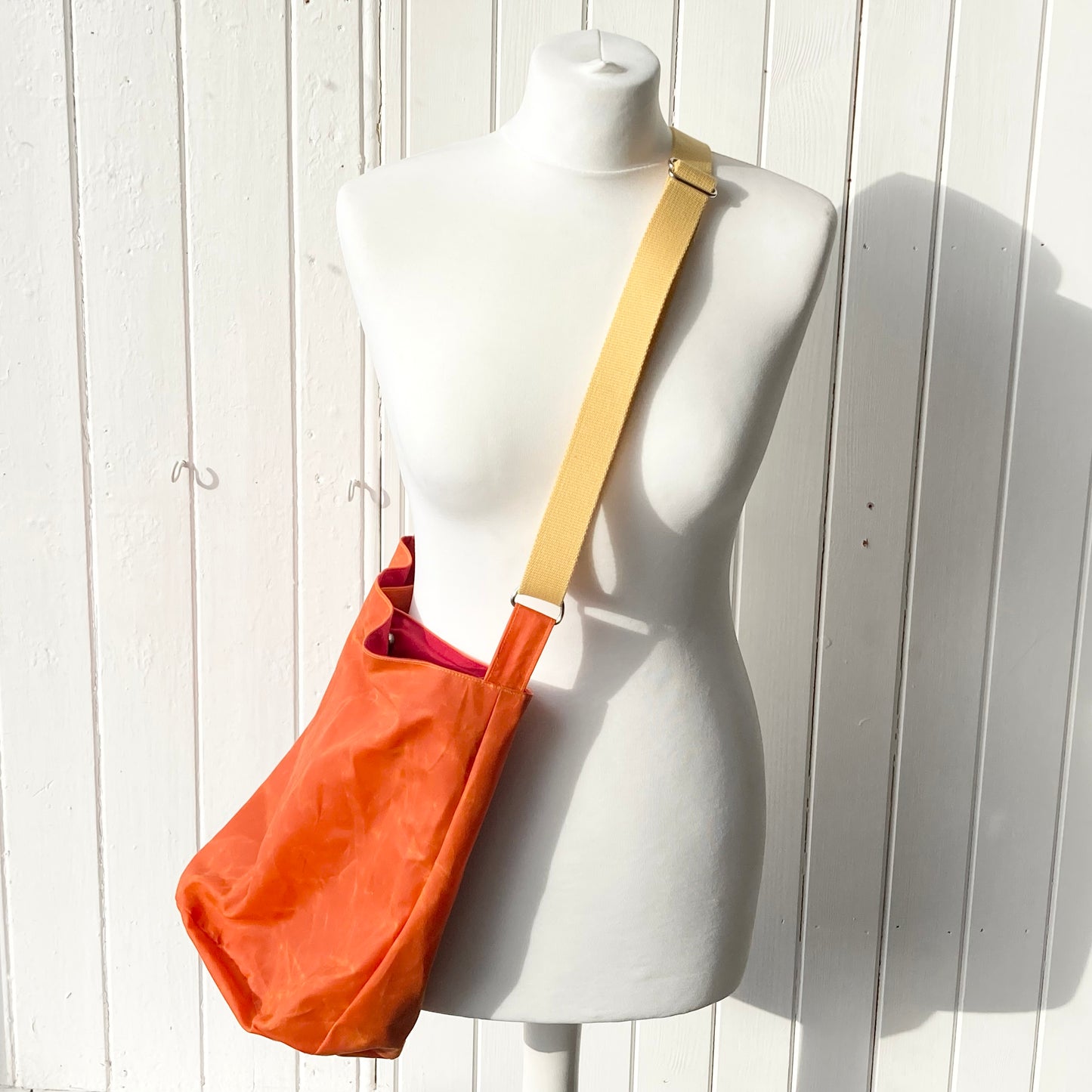 medium orange with red lining oilskin bucket bag