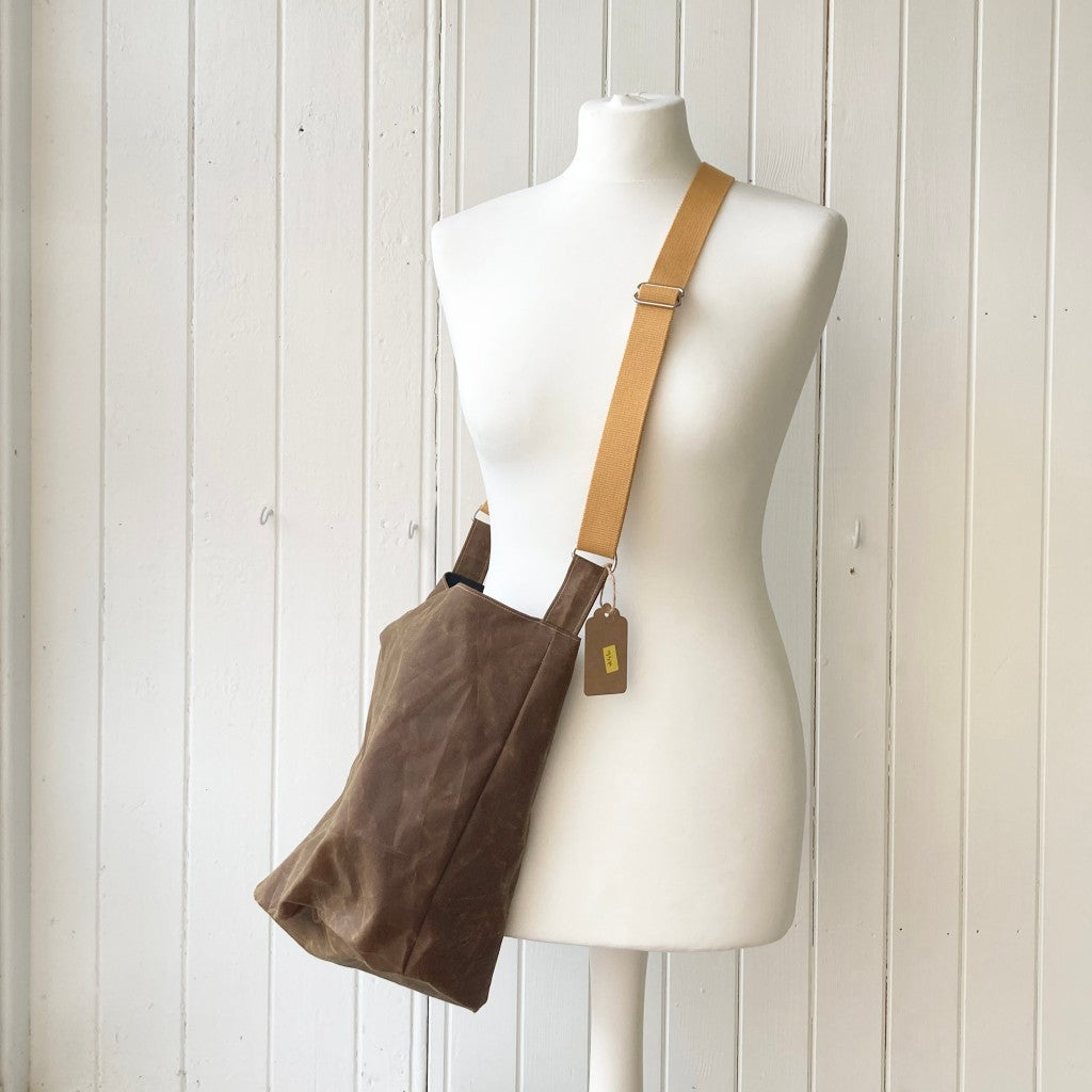medium tan oilskin bucket bag
