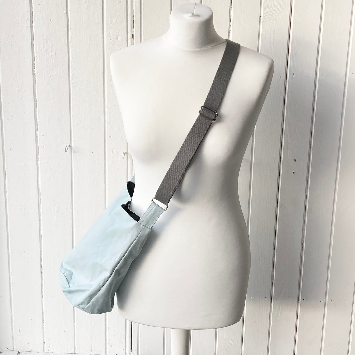small pale blue oilskin bucket bag