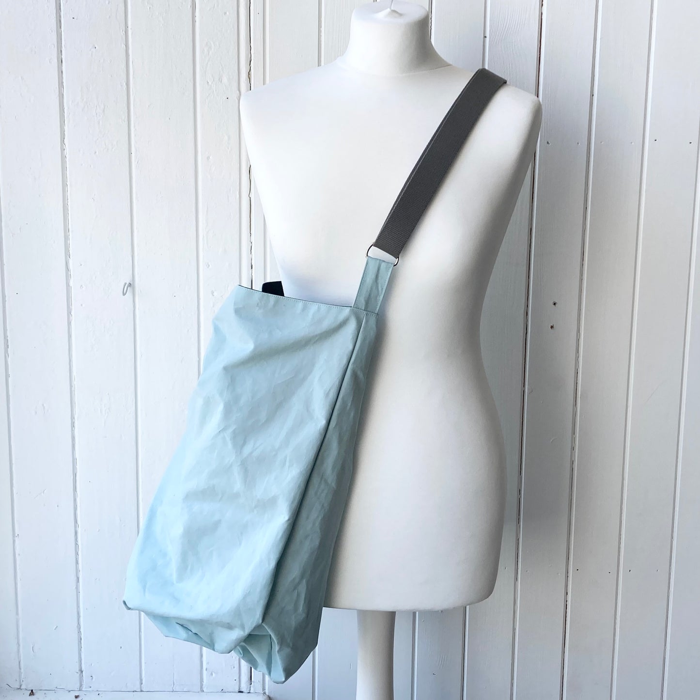 large pale blue oilskin bucket bag