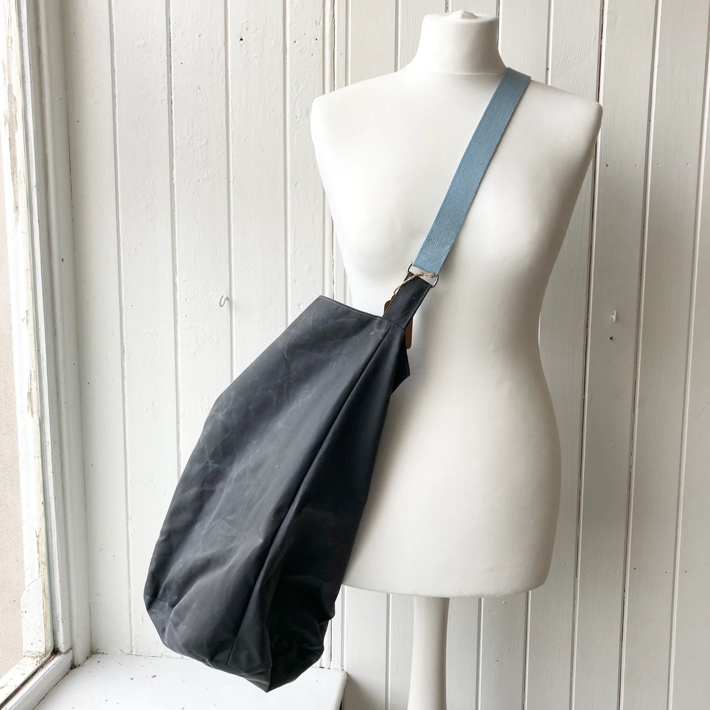 large grey with blue strap oilskin bucket bag