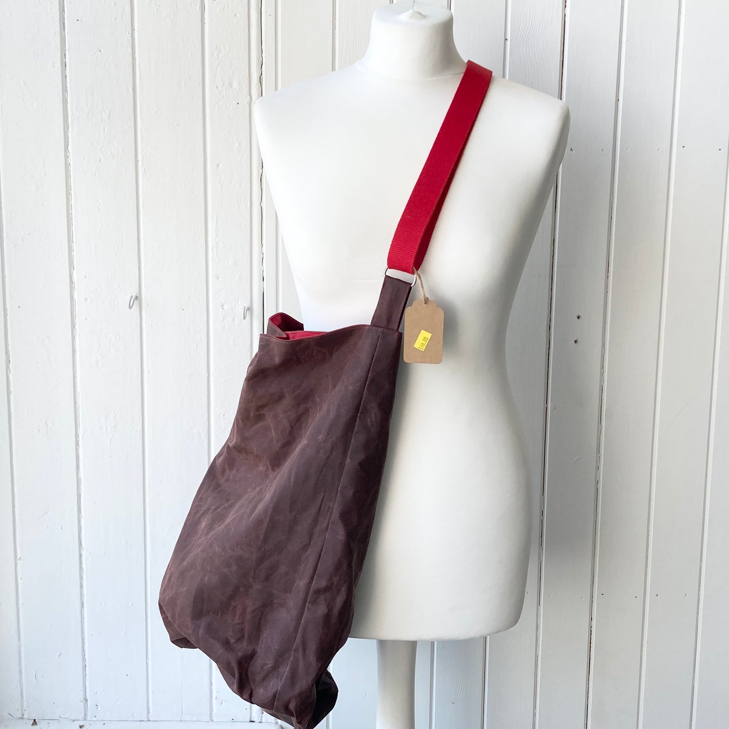 large conker with red lining oilskin bucket bag