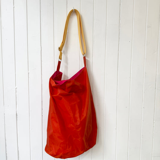 large orange oilskin bucket bag