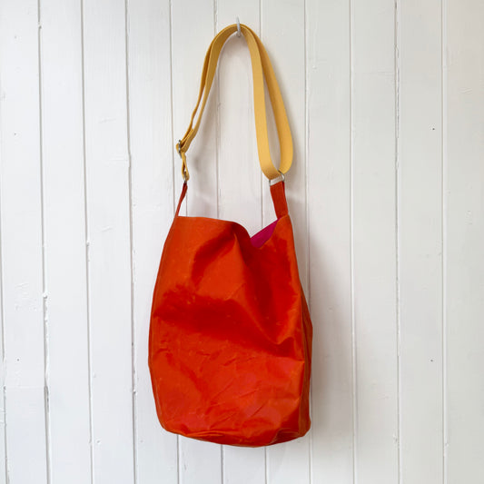 medium orange oilskin bucket bag