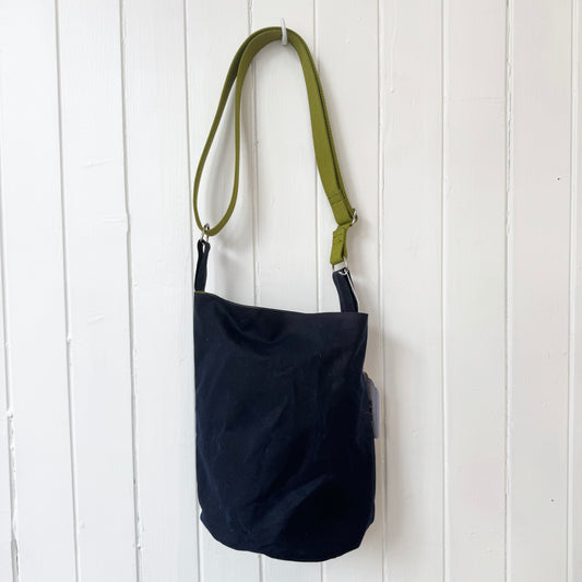 small dark blue oilskin bucket bag