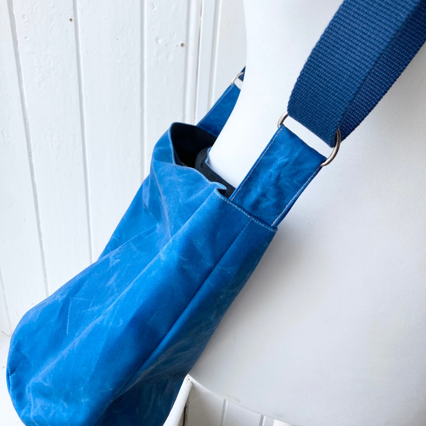 small bright blue oilskin bucket bag