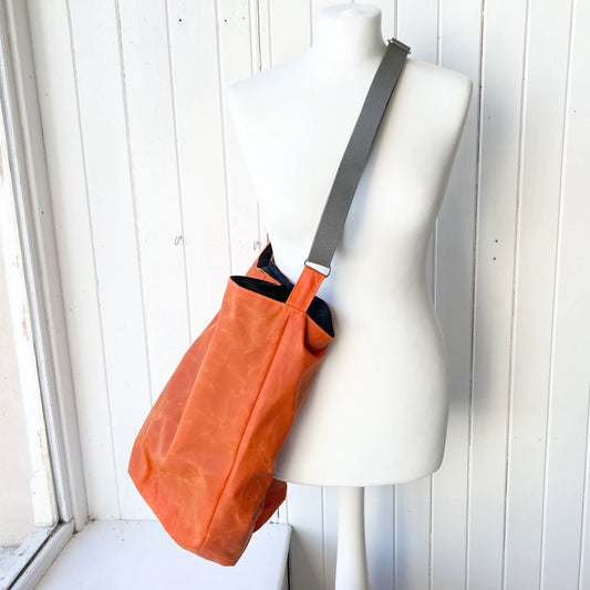 large orange oilskin bucket bag